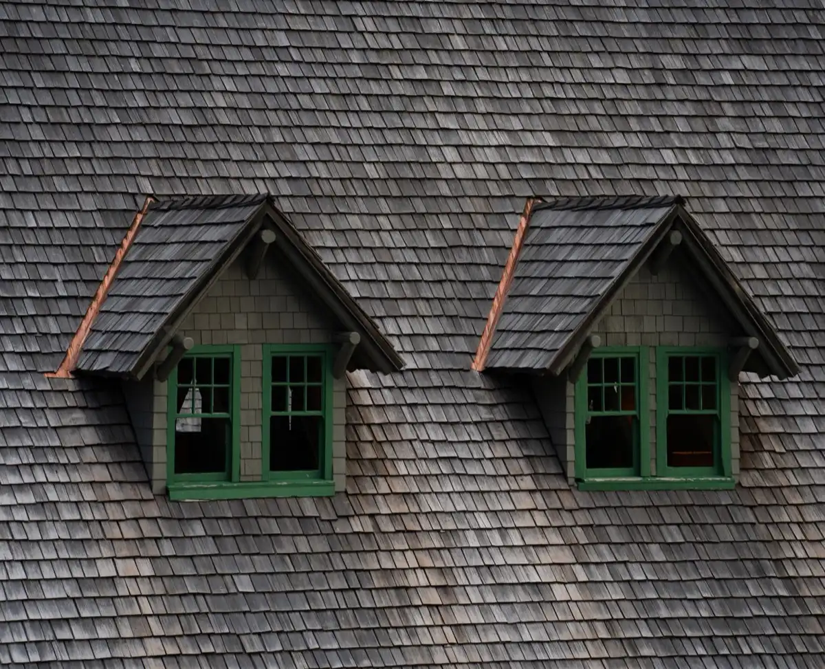 Dormers on a shingle roof in Hamilton, OH, where step flashing and kickout flashing carry water past the walls